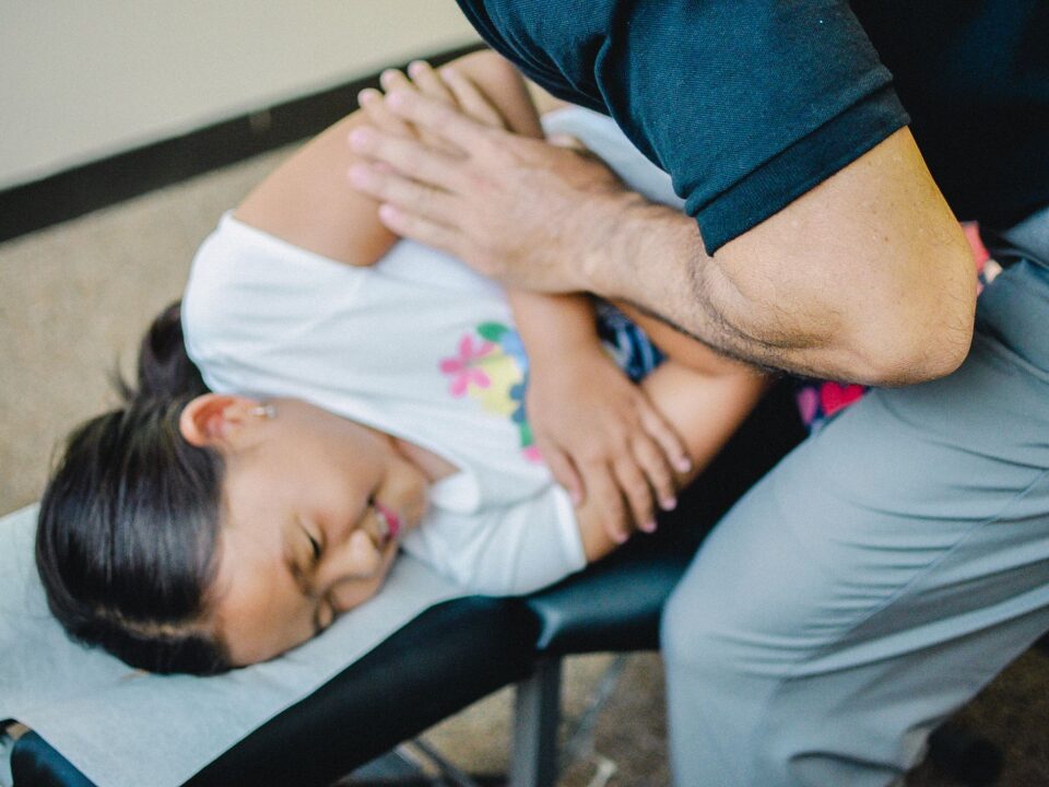 Dr. Shaun giving a child an adjustment