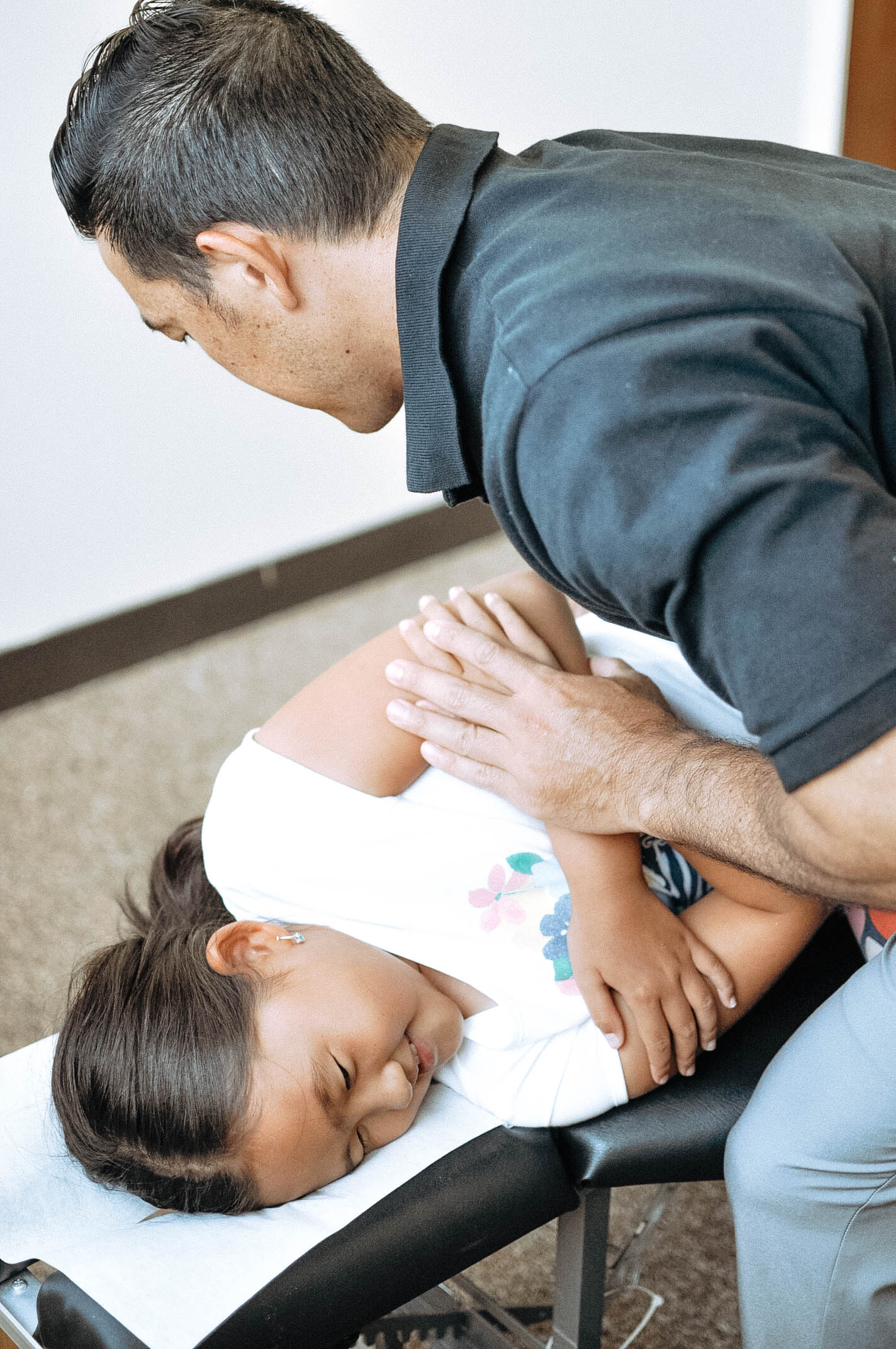 Chiropractor with child.