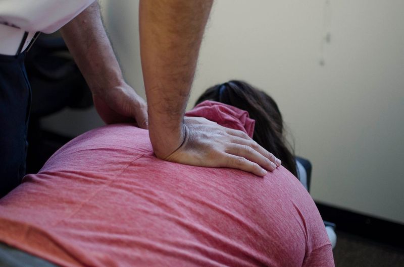 Dr. Shaun adjusting patient's neck.
