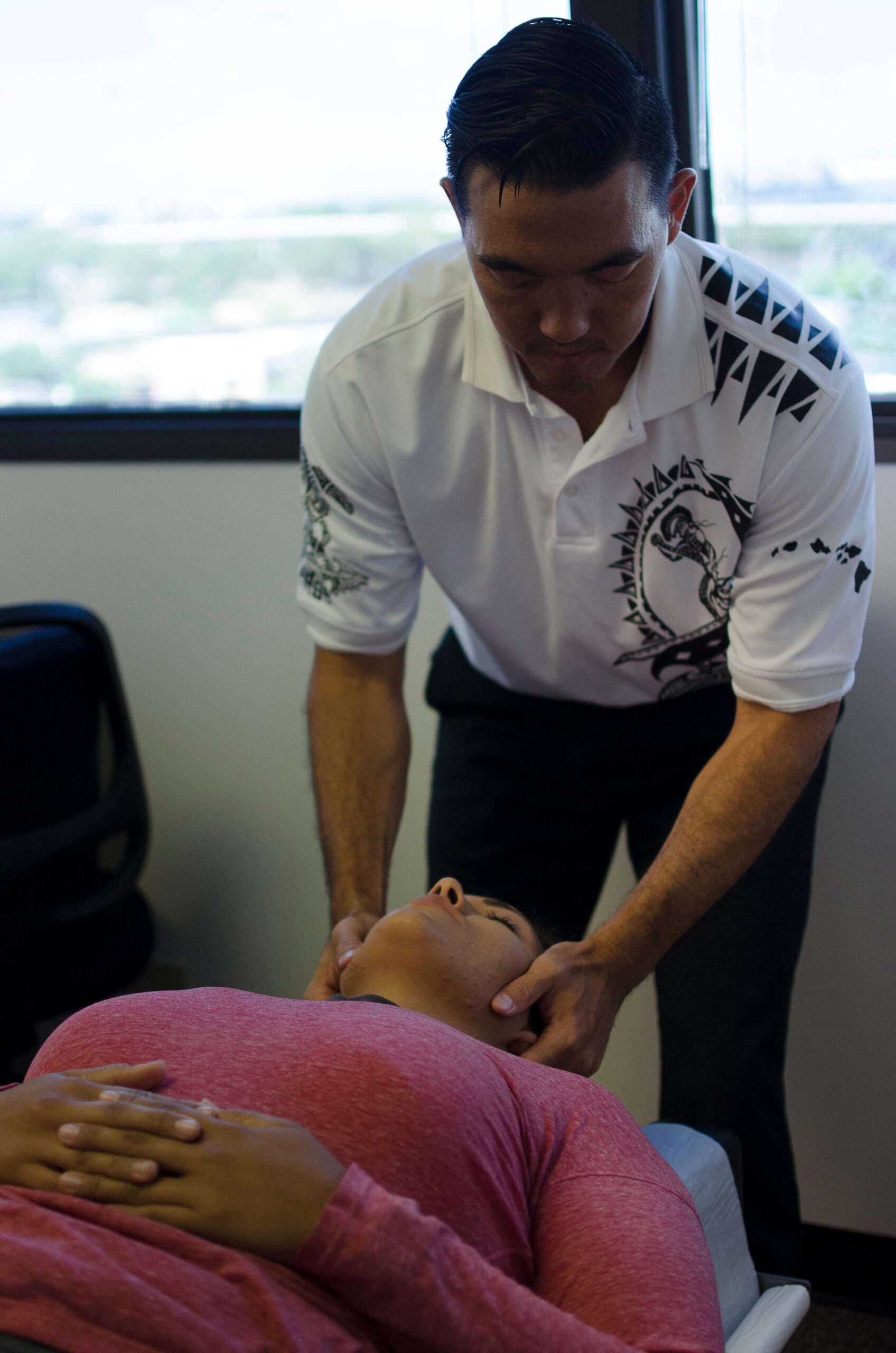 Dr. Shaun adjusting patient's neck.