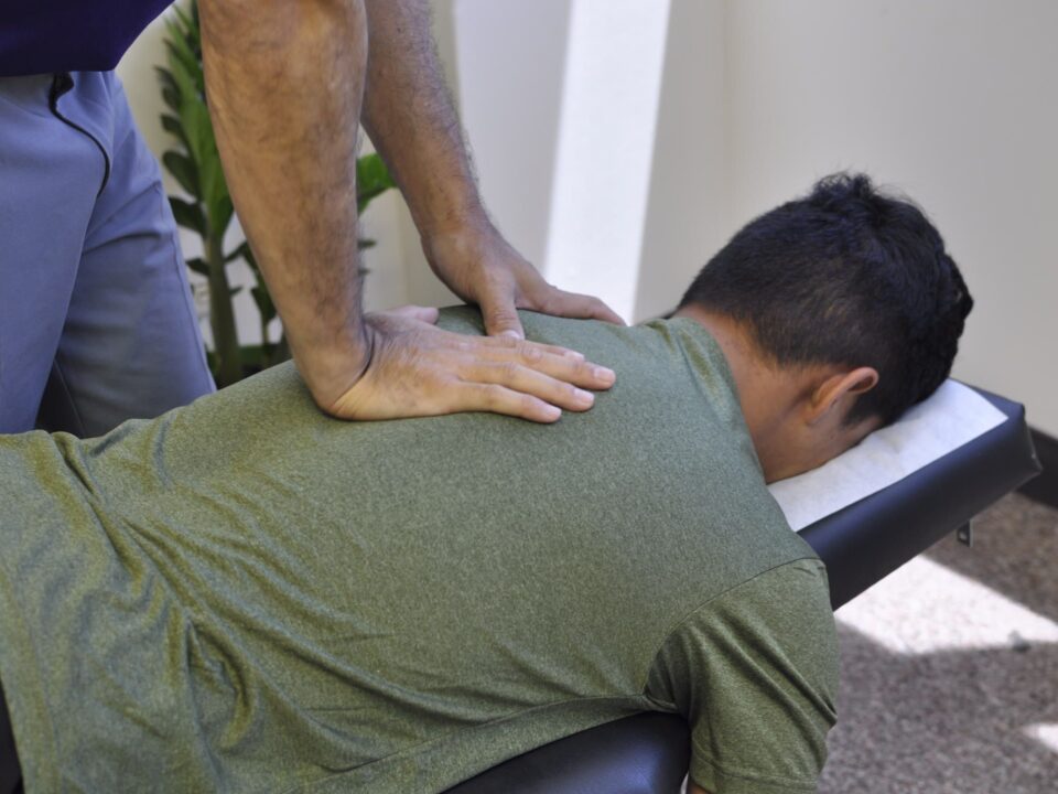 Dr. Shaun adjusting patient's neck.