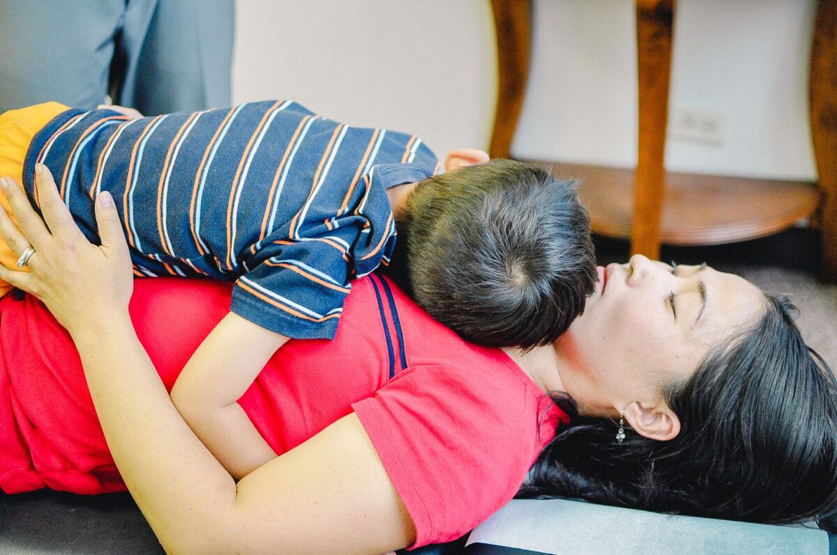 Mother and child getting chiropractic care. 