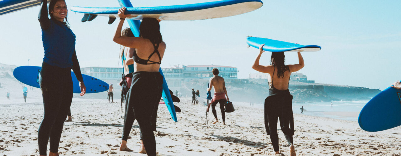 Surfers on the beach in Hawaii.