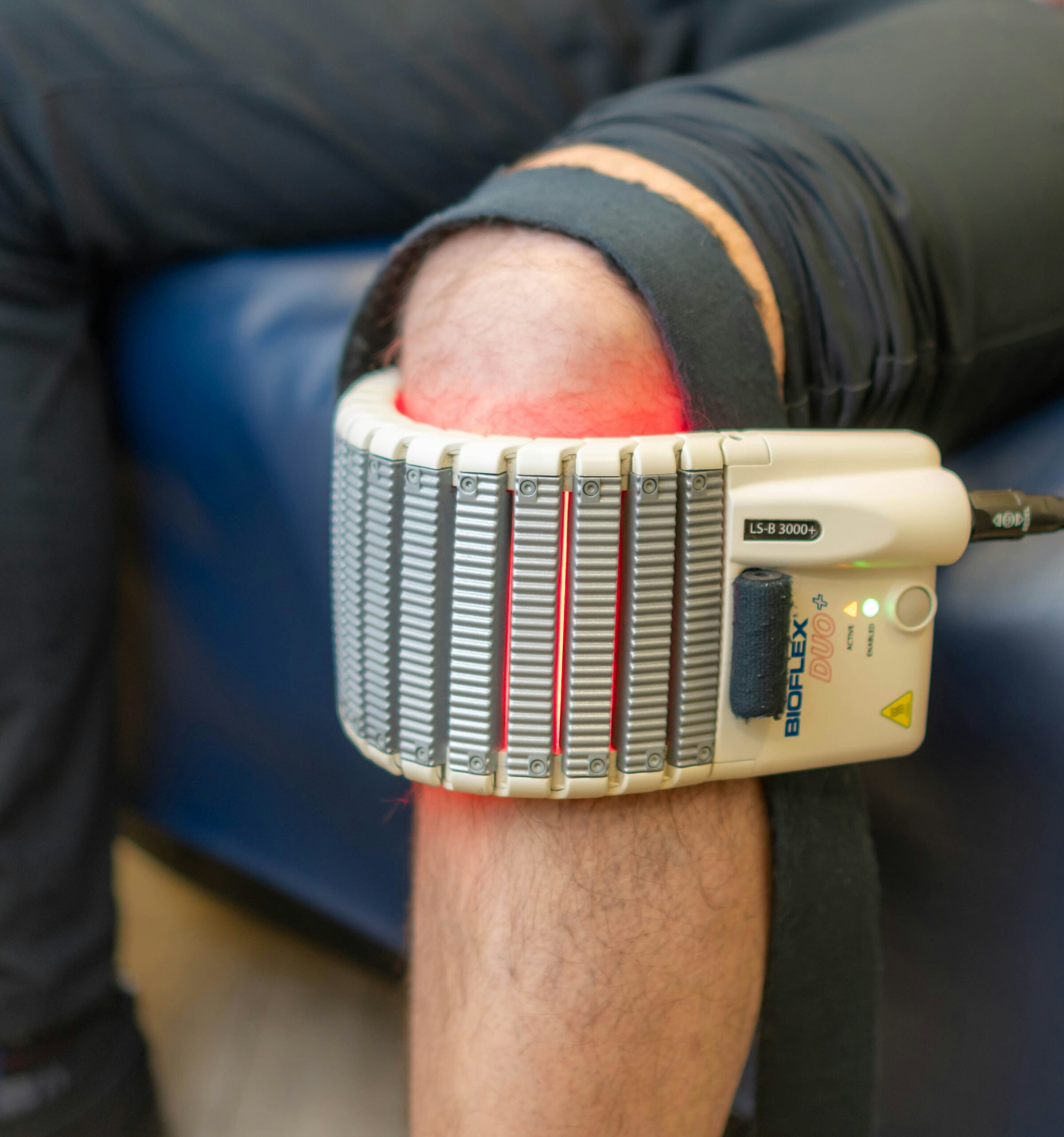 Laser therapy device on a person's knee