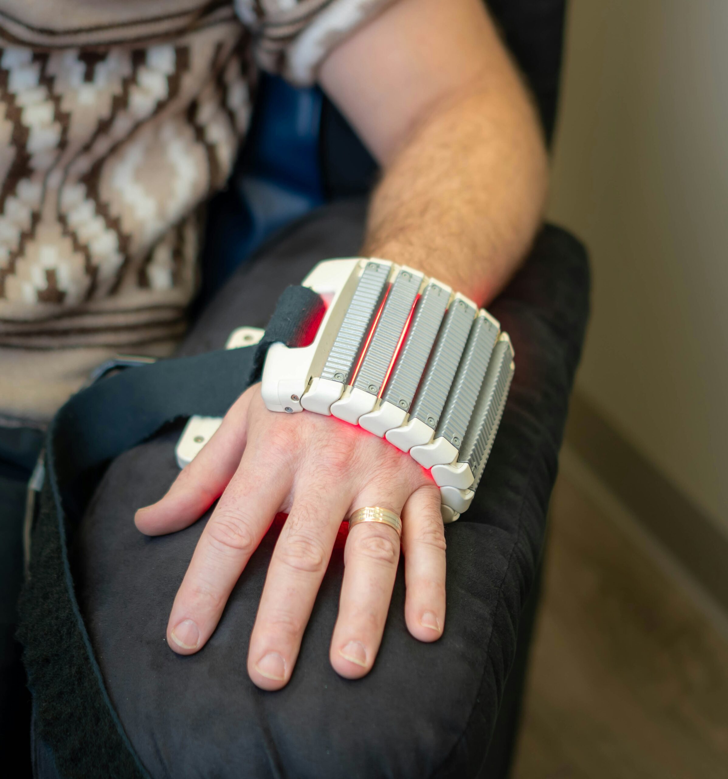Someone with a laser device on their wrist