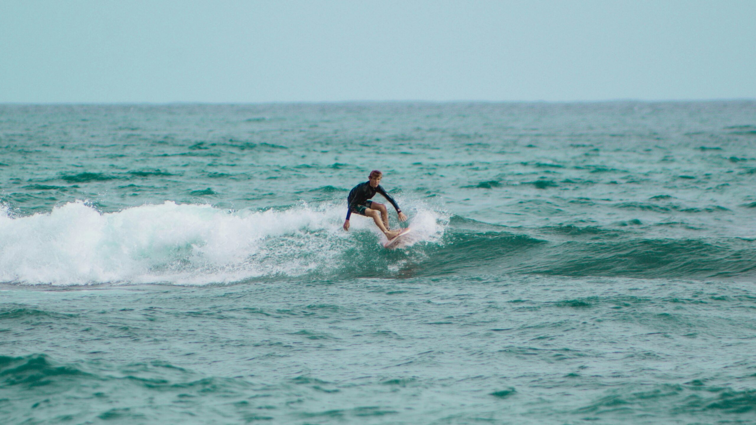 A surfer riding a wave