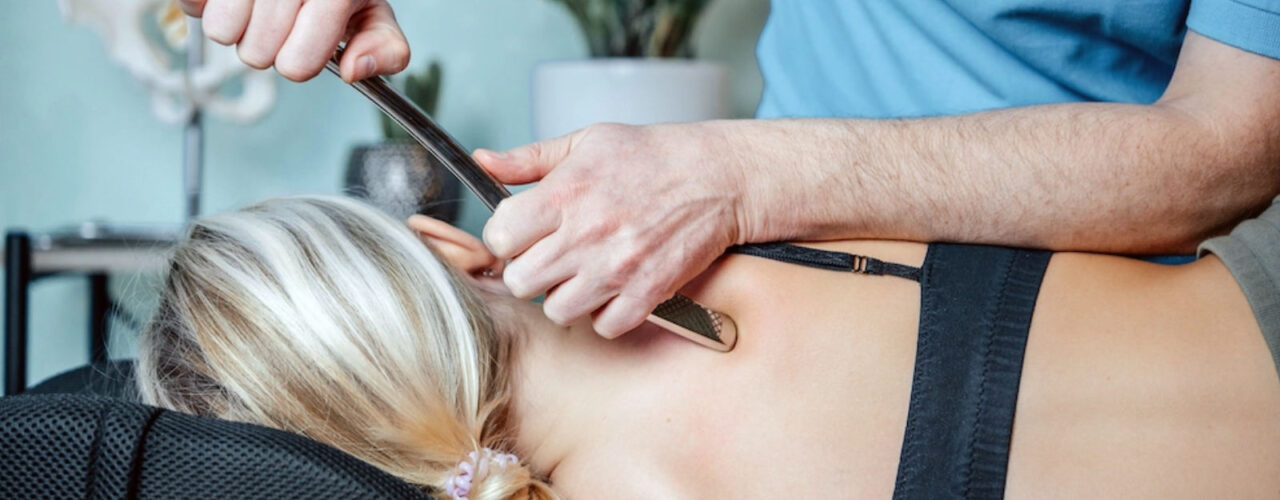 A chiropractor using the graston technique