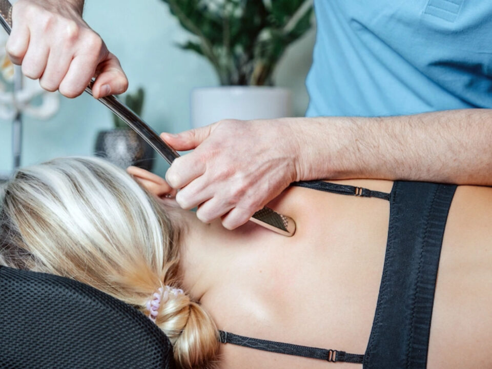 A chiropractor using the graston technique
