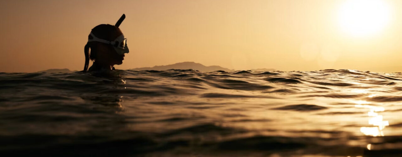 A woman snorkeling in the ocean
