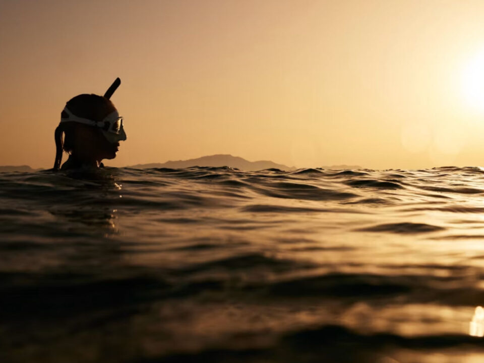 A woman snorkeling in the ocean
